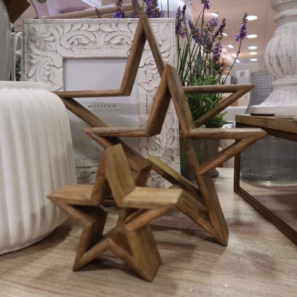 Set of three wooden stars in size order. Can be styled inside one another or separately.