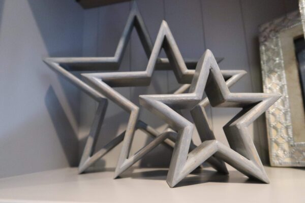 Three decorative Grey Stars with a distressed finish. They can sit apart or slot into one another