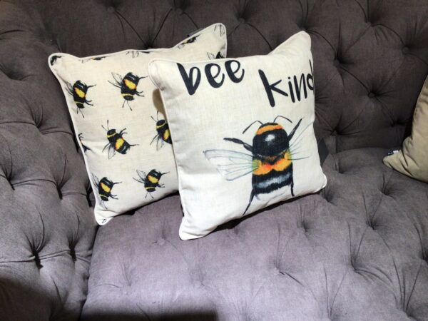 Bee Motif cushion with a cream background